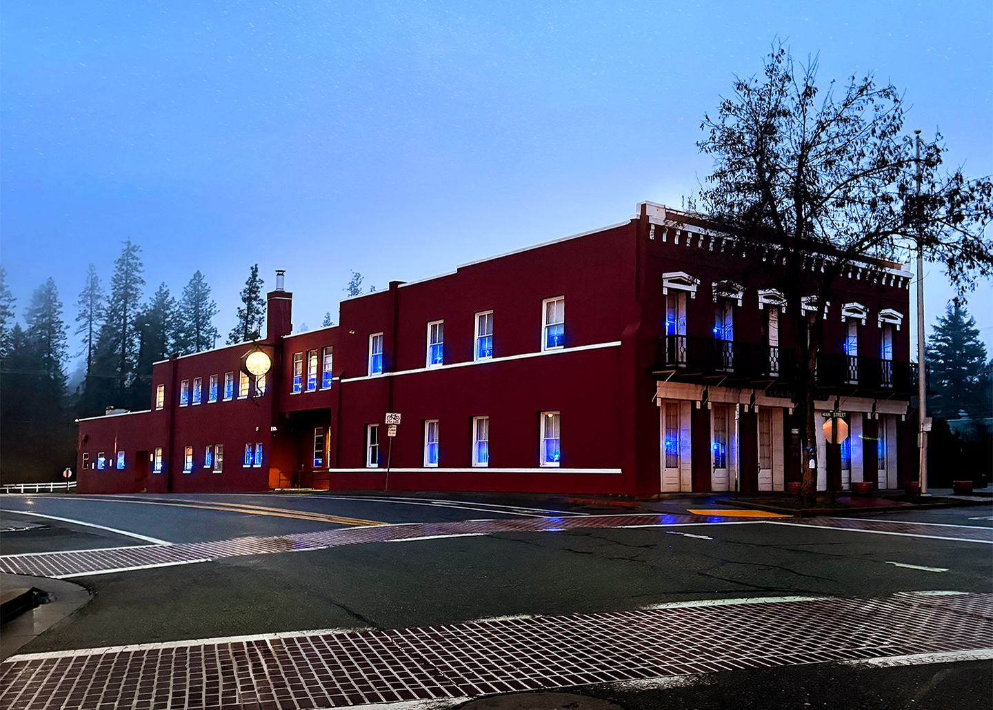 The windows of the Historic Trinity County Courthouse are light up blue.