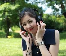 Smiling teenage girl listening to music